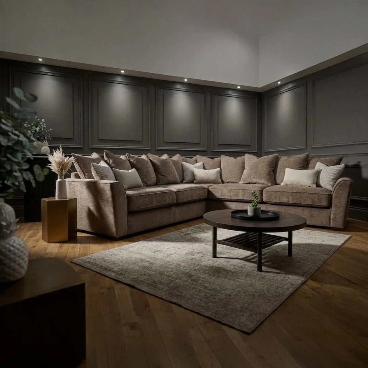 Luxury Buoyant Caspian Marlon taupe corner sofa with plush scatter cushions and sleek dark wood feet.