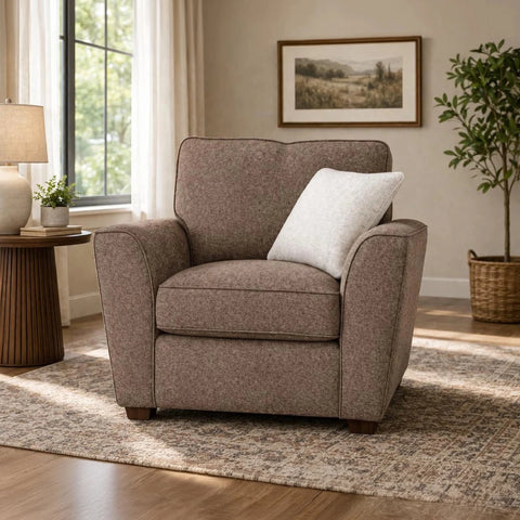 Luxury Buoyant Caspian Marlon taupe fabric armchair with a plush accent cushion and sleek dark wood feet.