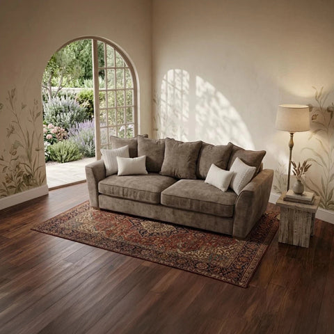 Luxury Buoyant Caspian Marlon taupe 3-seater sofa with plush scatter cushions and sleek dark wood feet.