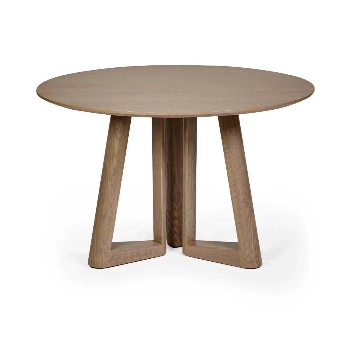Cara 120cm Smokey Oak Effect Round Dining Table. Featuring a warm wood-effect finish, sculptural architectural base and elegant circular top.