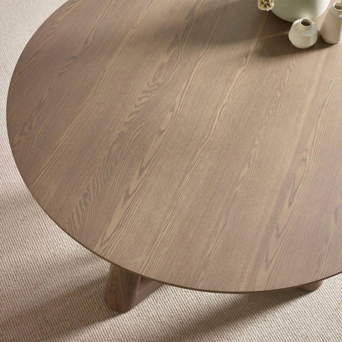 Table top of Cara 120cm Smokey Oak Effect Round Dining Table. 