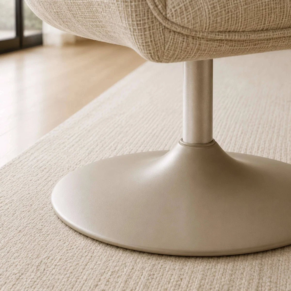 Close-up of a Caspian Ivory Chenille Swivel Lounge Chair with a textured base on a carpeted floor.