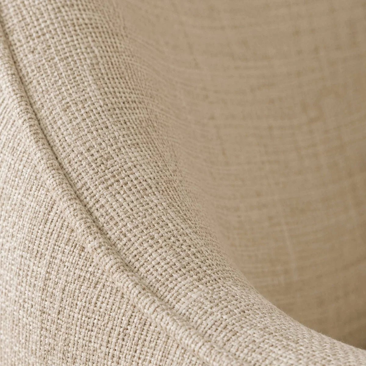 Close-up of a woven fabric upholstery of Caspian Ivory Chenille Swivel Lounge Chair