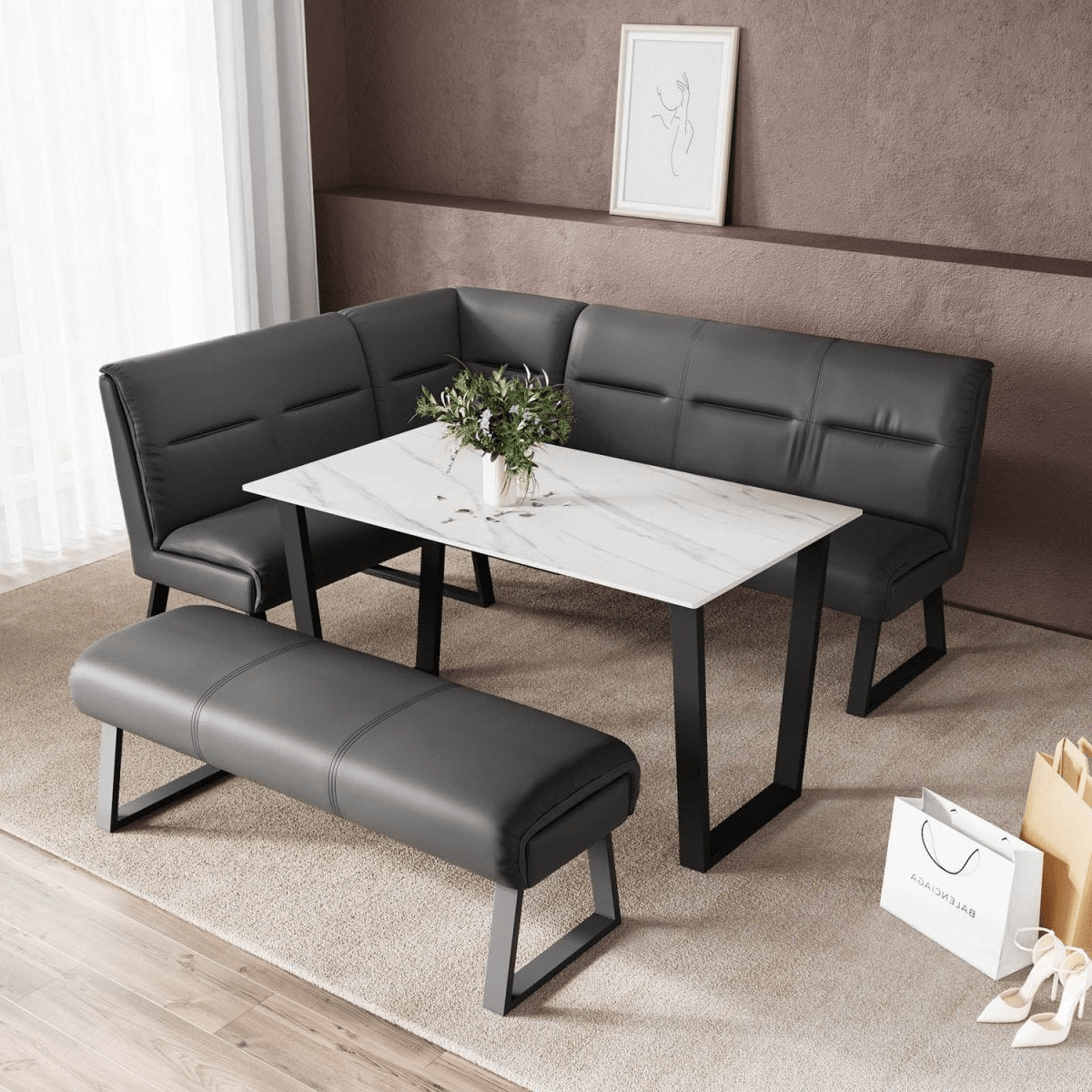 A modern 5-piece cafe dining set featuring a white marble-patterned rectangular table with black metal legs, a matching black faux-leather 3-seater bench, and a separate black bench. The set is styled in a living room setting with a brown textured wall, a beige rug, and a small potted plant on the table.