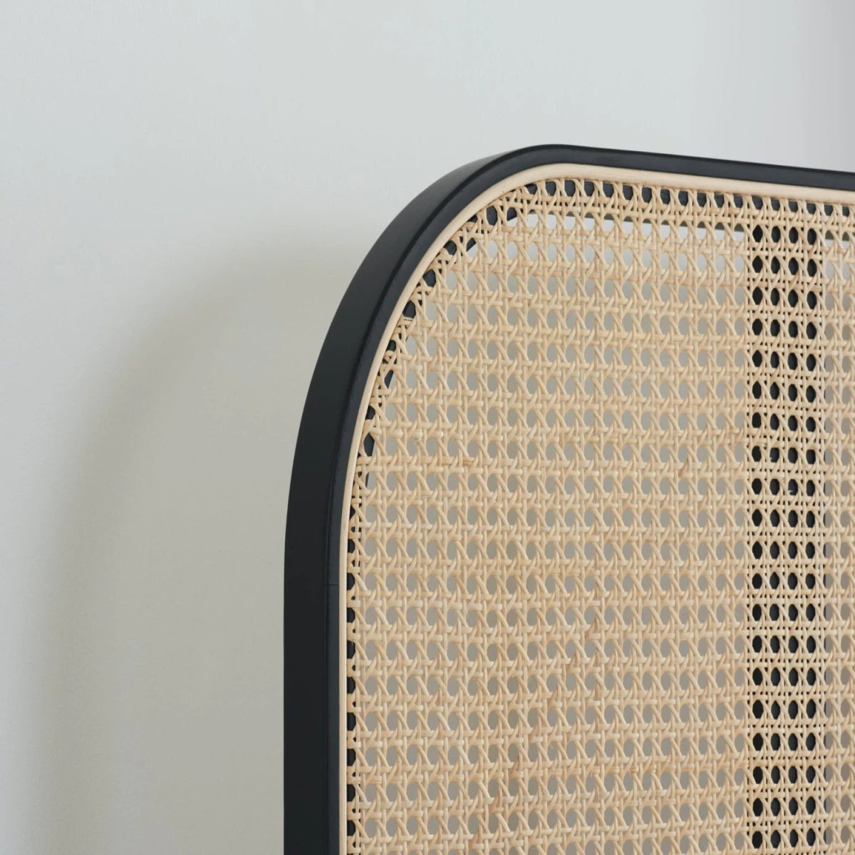 Stylish woven rattan headboard with soft curved shape.