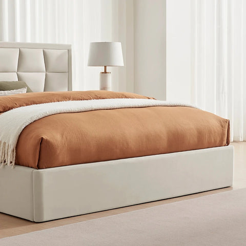 Close up of modern platform bed with an upholstered natural cream headboard and base. Available in a choice of 3 colours and sizes. 