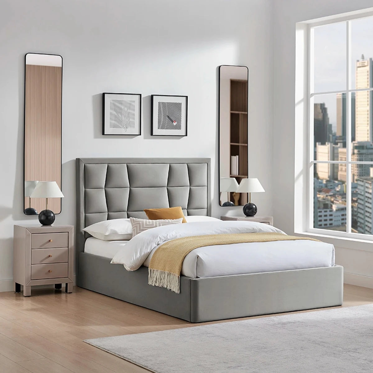 A modern silver grey upholstered bed with a tufted headboard and storage base. The Camila Luxury Storage Bed is available in Silver, Natural or Navy and 3 sizes from Double, Kingsize or Super king.