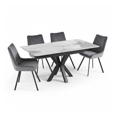 Compact sintered stone dining table with grey velvet chairs. Extends from 90 to 150cm, seating up to 6. Stylish and space-saving for modern interiors.