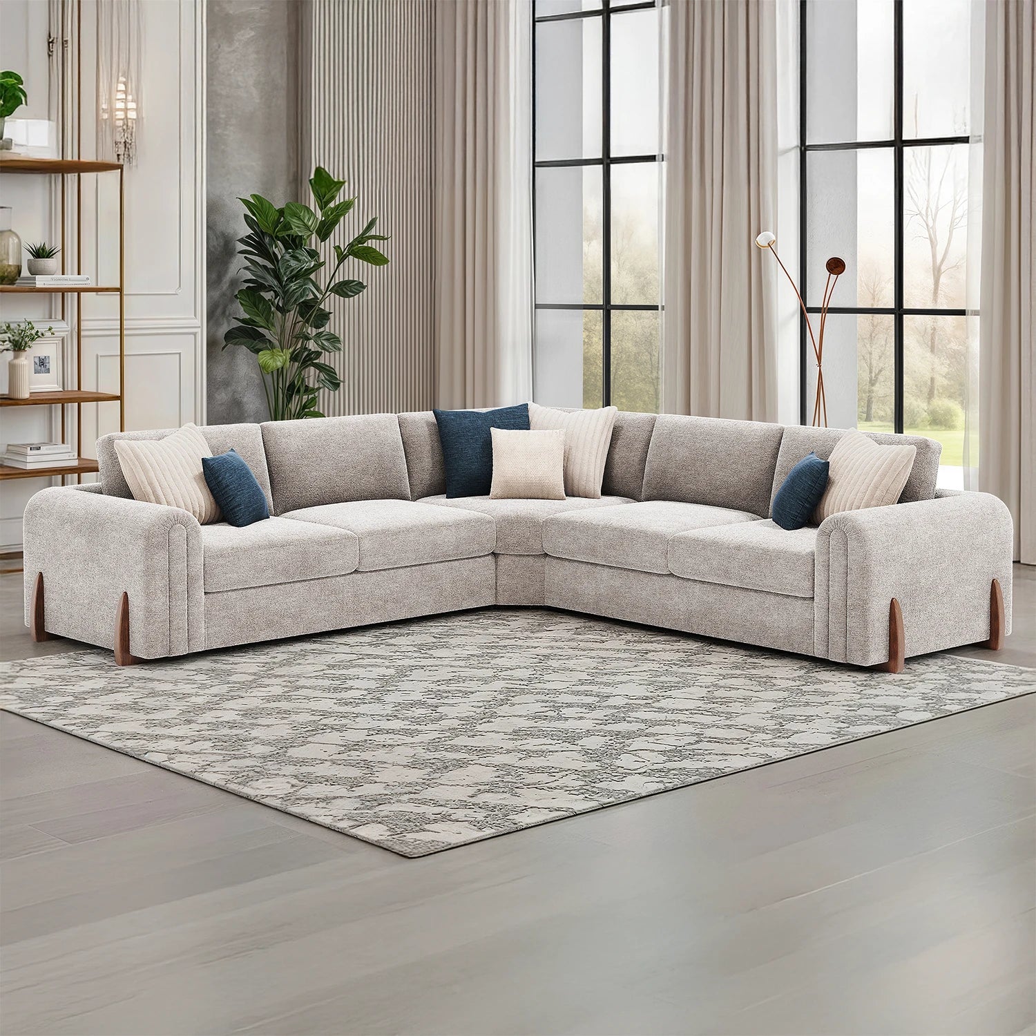 Gray sectional sofa with decorative pillows in a living room setting.