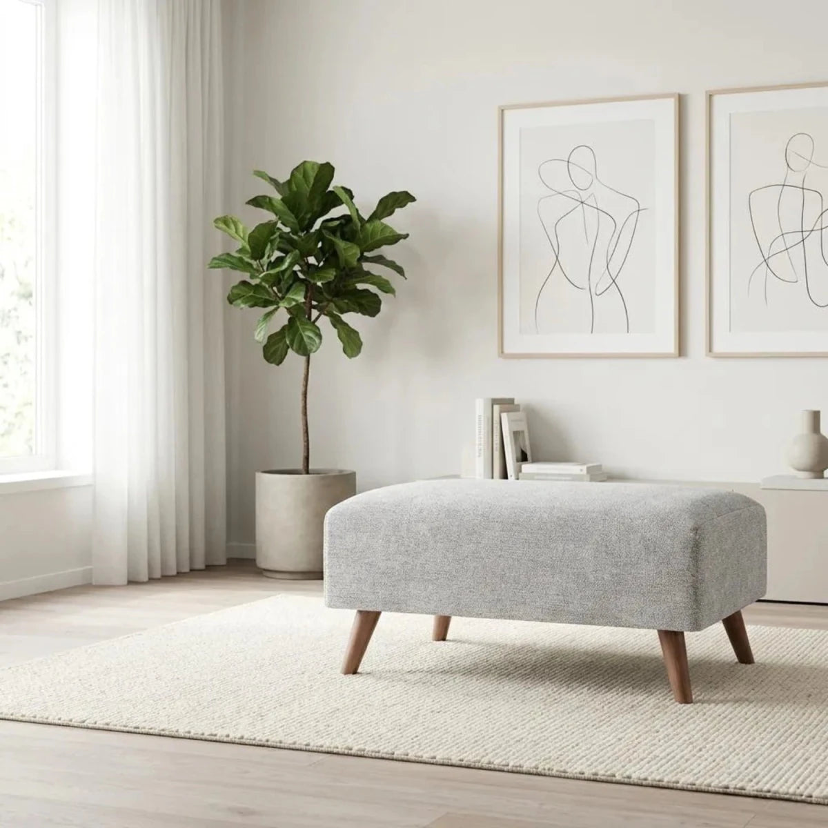 Cavendish fabric footstool with modern design and soft cushioning.