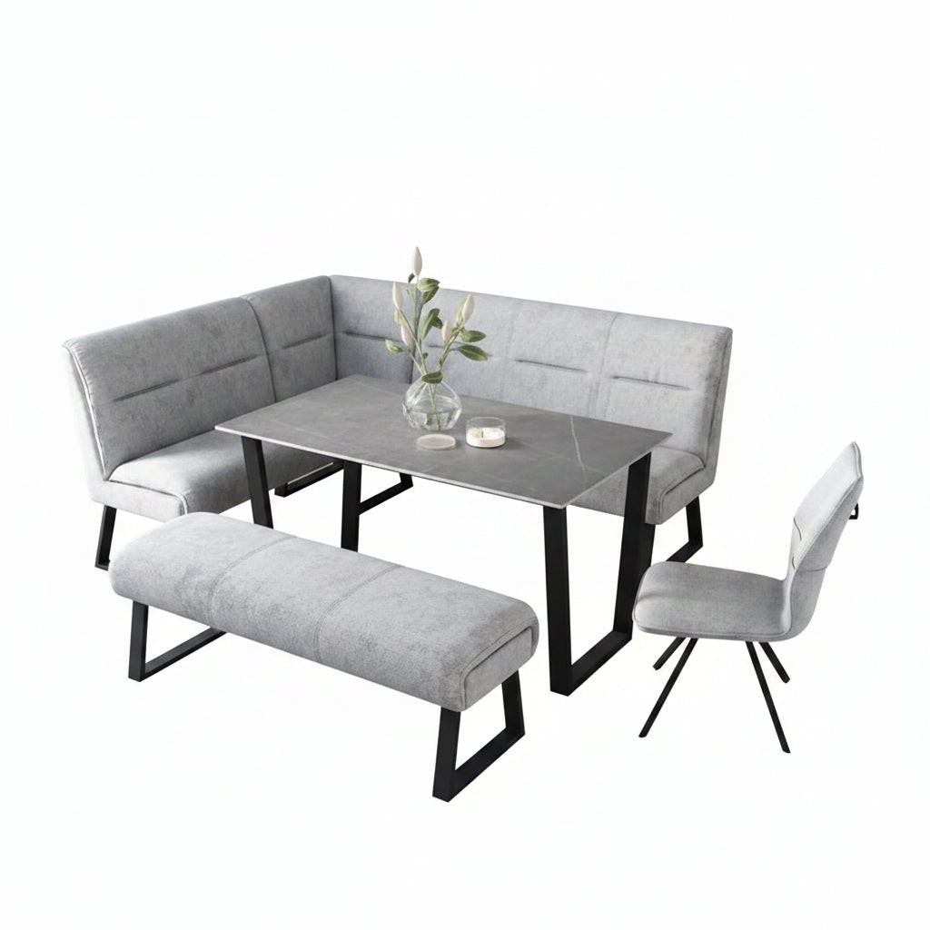 Modern dining set with grey fabric corner bench, grey ceramic dining table, and grey backless bench with white background 