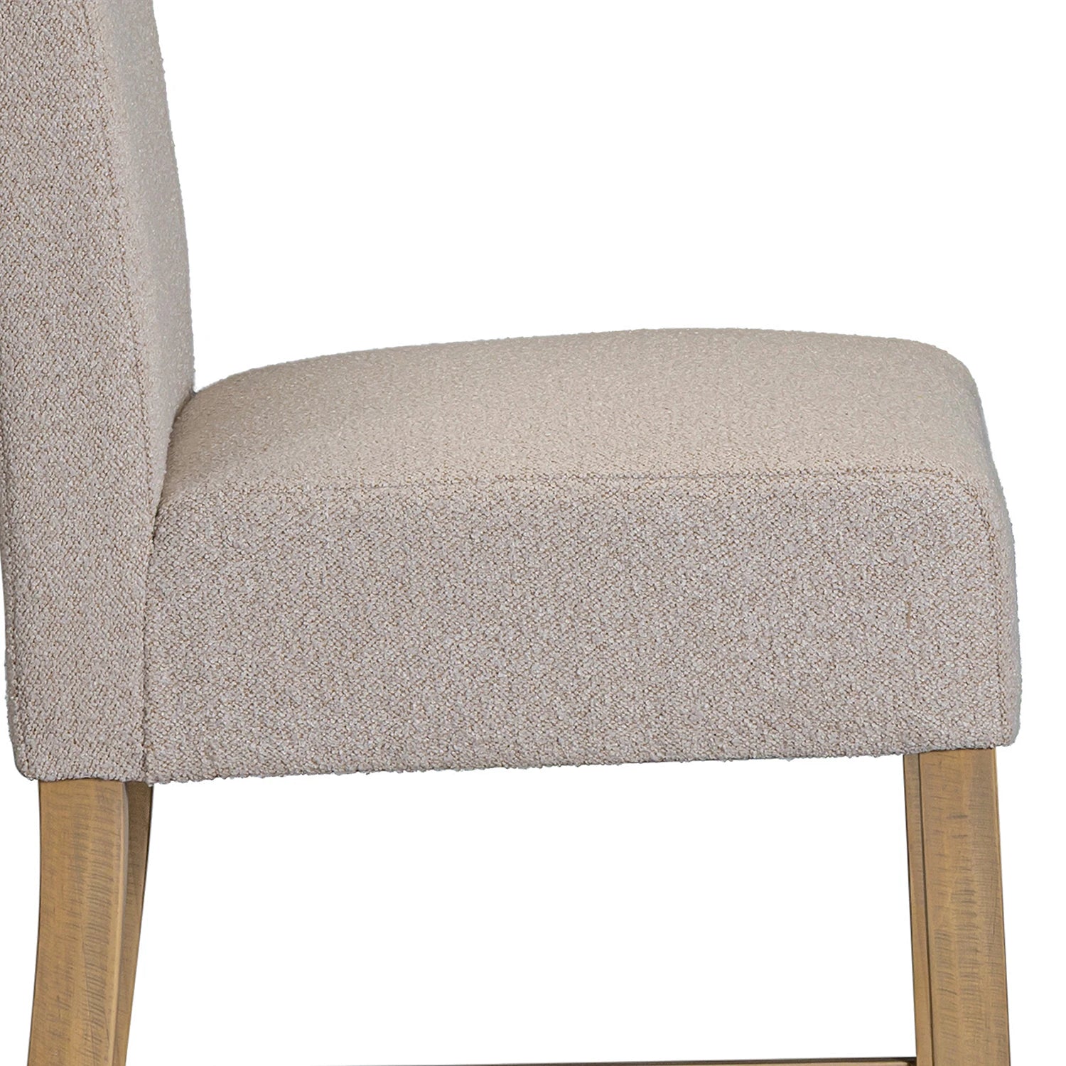 Seat Close up of Chateau Hing Back Beige upholstered chair with wooden legs on a white background