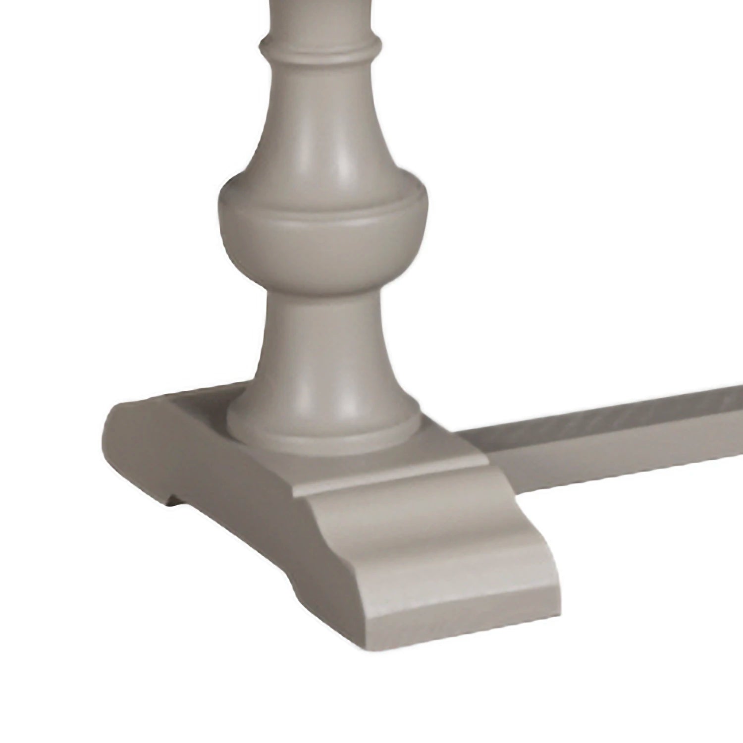 Close-up of a decorative column base of A rustic dining bench with a light natural wood seat and a painted gray base and stretcher bar, shown on a plain white background.