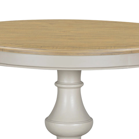 A close-up of a rChateau Grey & Rustic Pine Round Dining Table