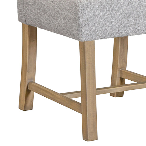Close-up of a leg base of Gray upholstered chair with wooden legs on a white background