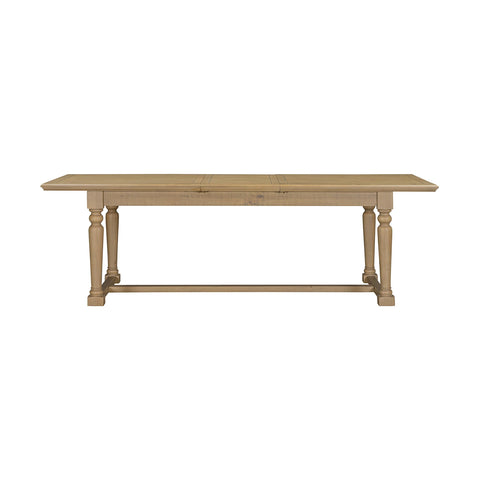 A light natural wood dining table with turned legs and a stretcher base, shown from a front angle on a solid white background.
