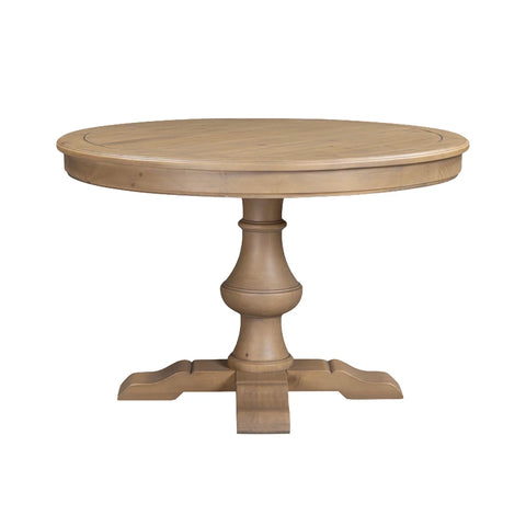A round Pine pedestal dining table with a light natural wood finish, featuring a turned central pedestal base and a four-leg footed pedestal design, shown on a plain white background.