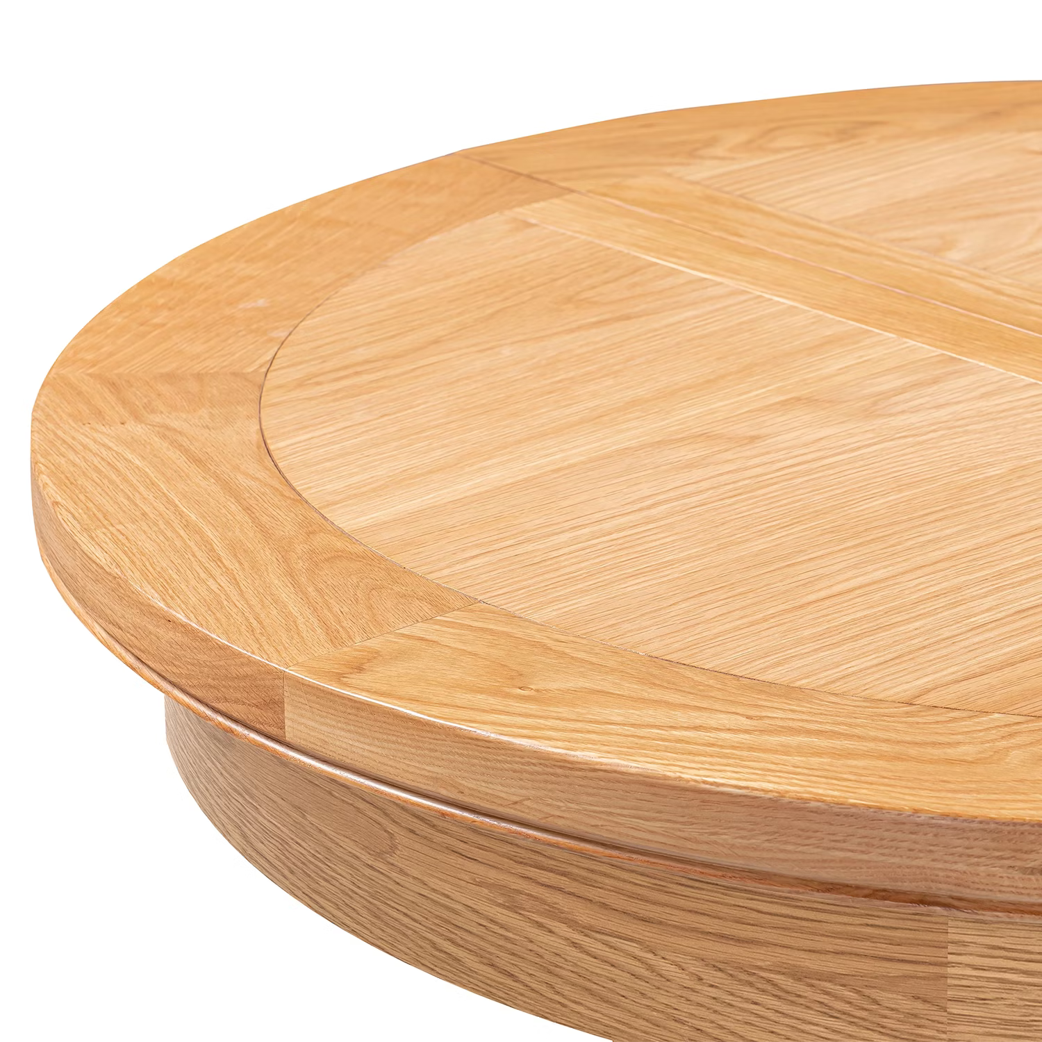 Close-up of a round wooden table top with a light oak finish, showing the grain pattern and circular inset detail on a white background.