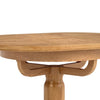 Close-up of a round wooden dining table with a natural oak finish, showing the tabletop grain, a decorative central support, and part of the pedestal leg against a white background.