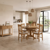 Shop the Chatsworth oak round extending dining table with 4 chairs. Includes a pedestal table with extension leaf and matching cross-back oak dining chairs.