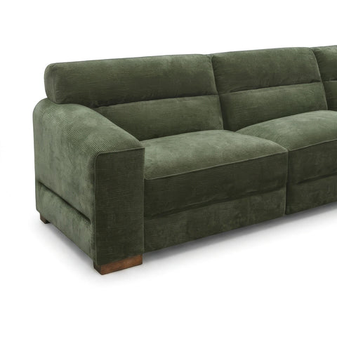 An olive green corduroy sofa with a modern low-profile design and light wood block feet, shown from a three-quarter angle on a white background.