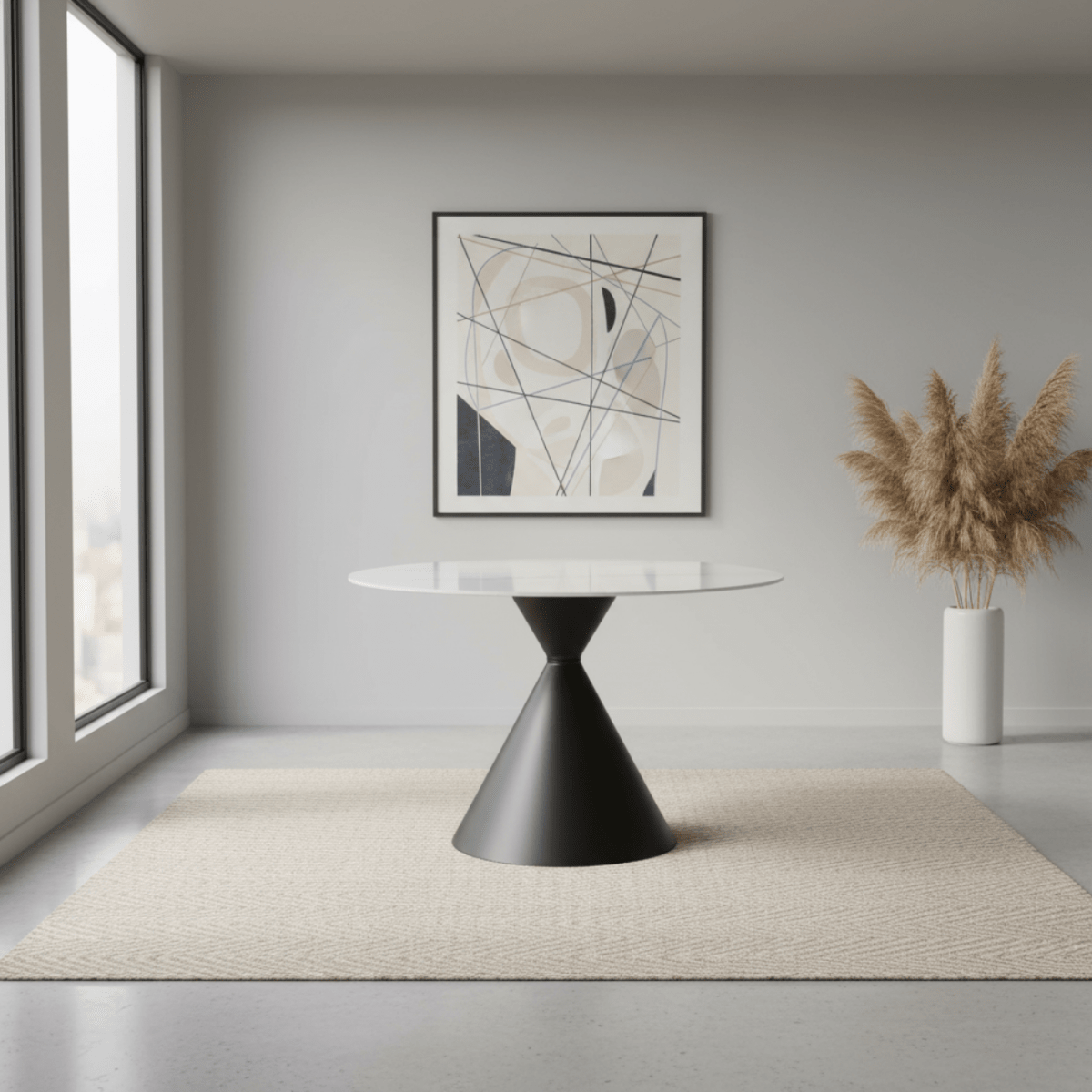 Modern interior with a black and white table, abstract art, and potted plant.