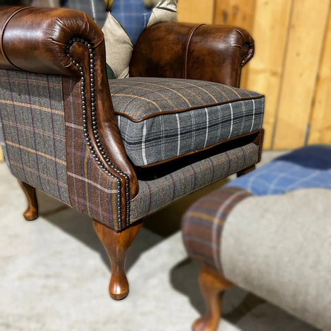 Close up of Cotswold Coloured Patchwork with Antique Tan Leather High Round Back Wing Chair