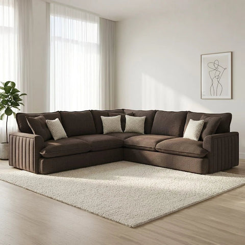 Modern corner fabric sofa with soft upholstery, deep comfortable seating, plush back cushions.