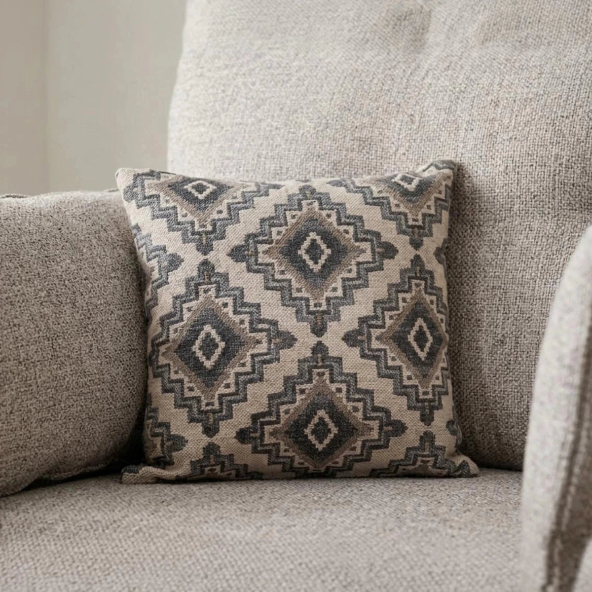 etail of scatter cushions showing textured fabric and modern design.