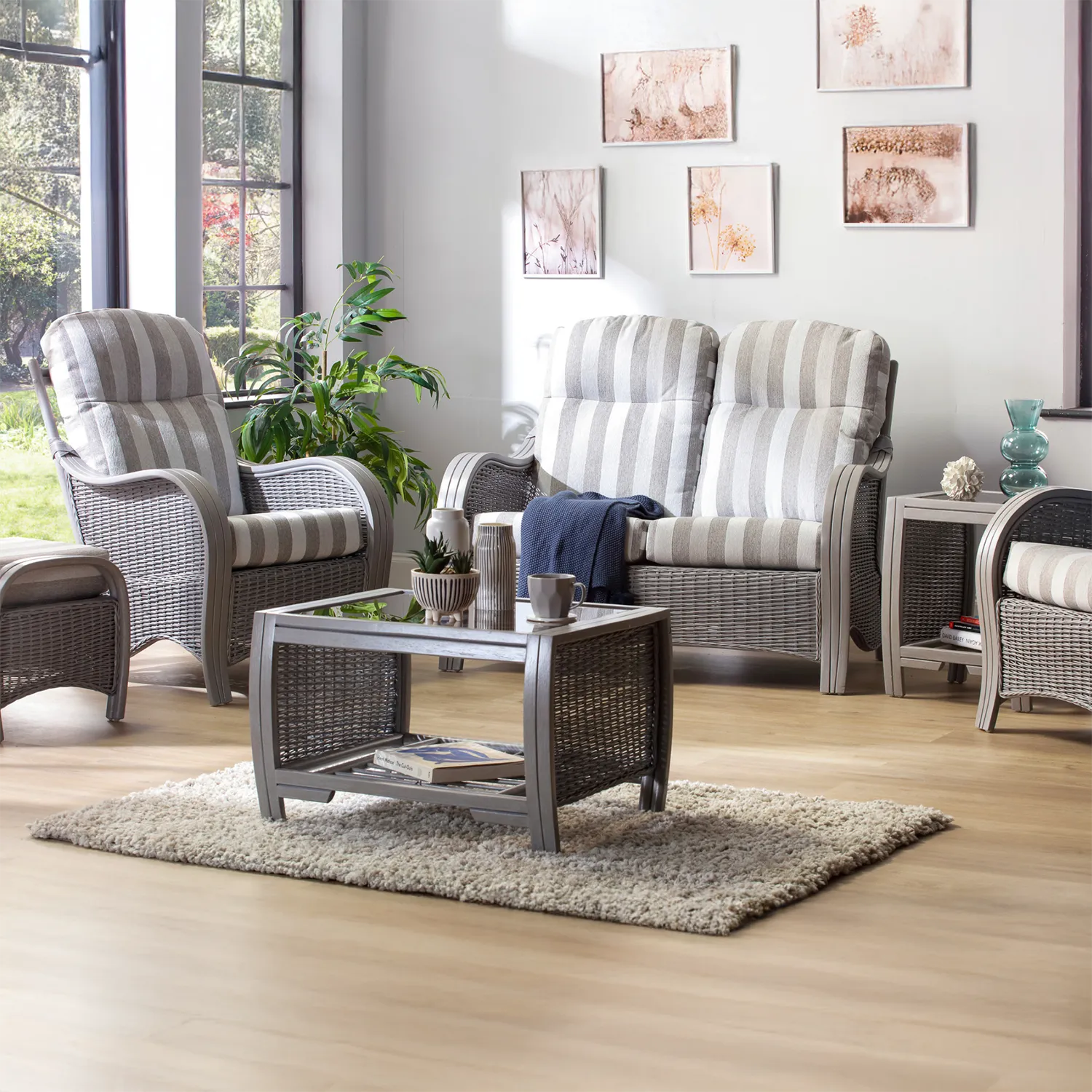 Desser Turin Grey Rattan 2 Seater Sofa in Duke Stripe fabric, also available in a 3 Seater, Swivel Rocker, Swivel Chair, Armchair and Footstool.  Choose from various fabrics and a Grey or Oak frame - Lifestyle Image 
