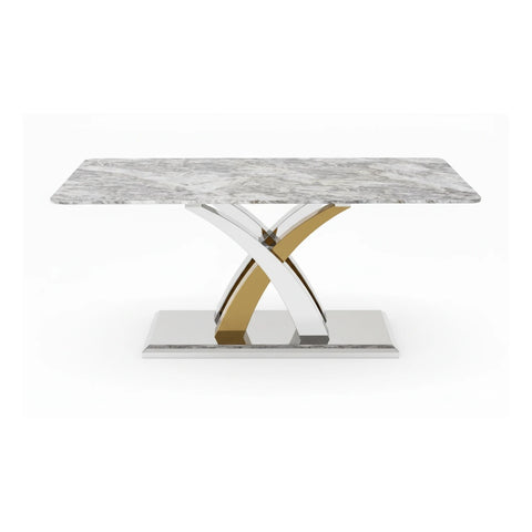 Dining table with grey marble top and gold and silver metal base on a white background