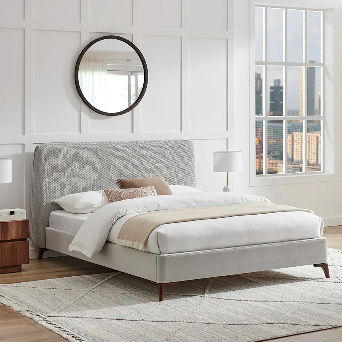 Dovira Luxe Bed is a light grey upholstered bed with a tall quilted textured headboard and velvet footend. Available in Grey or Natural fabric and in sizes Double or Kingsize.