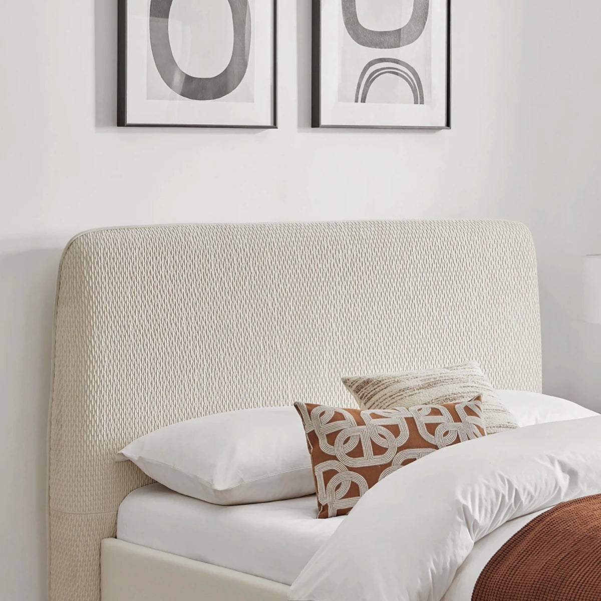 Close up of the Natural textured headboard on the Dovira Luxe Bed.