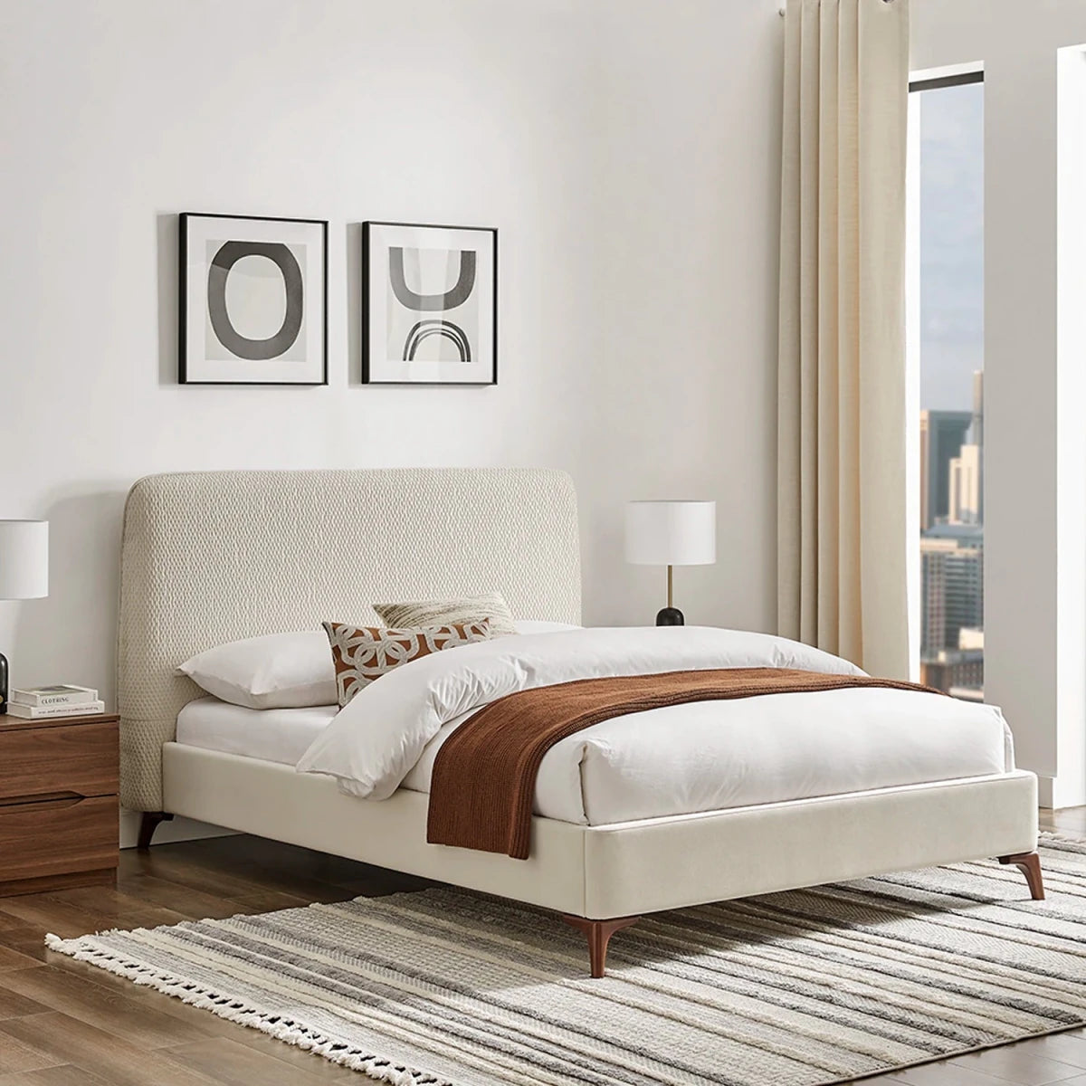 Dovira Luxe Bed is a natural upholstered bed with a tall quilted textured headboard and velvet footend. Available in Grey or Natural fabric and in sizes Double or Kingsize.