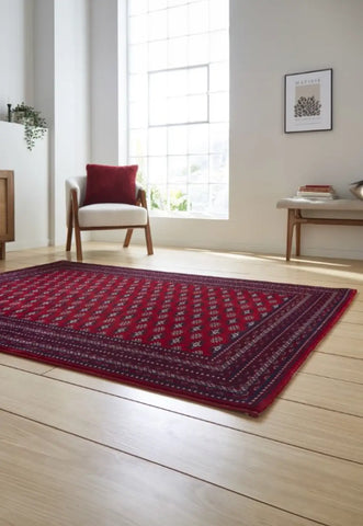 Dubai 62096 Traditional Patterned Border Rugs in Red - Angled Lifestyle Image 