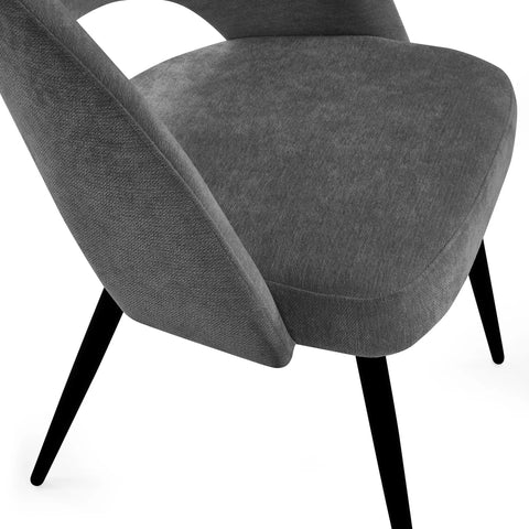 Gray upholstered chair with black legs on a white background