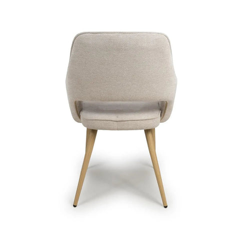 Back View of Eaton modern dining armchairs in Natural fabric. Soft padded seat, light wood legs & ergonomic shape for comfort & style.