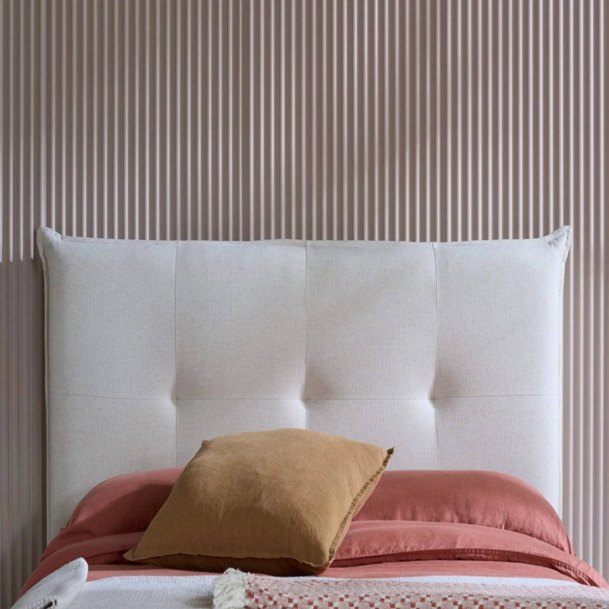 Modern upholstered bed with breathable fabric finish and refined look.