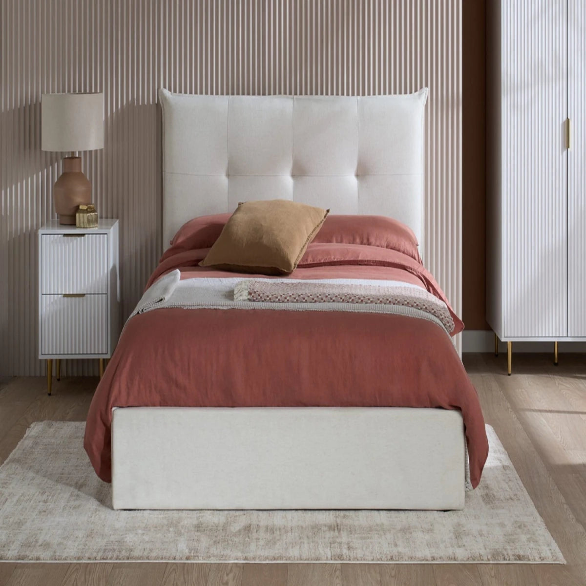 Modern button detailed headboard with soft cushioned finish.