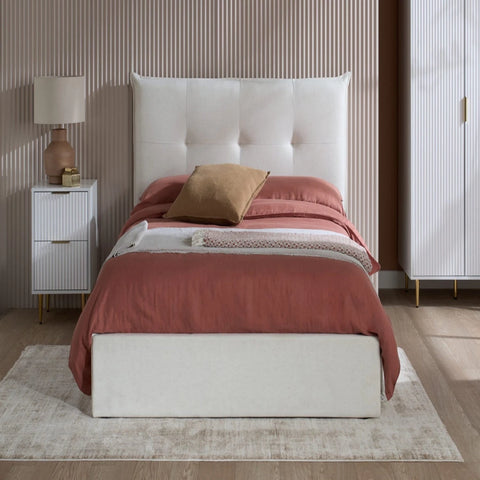 Modern button detailed headboard with soft cushioned finish.