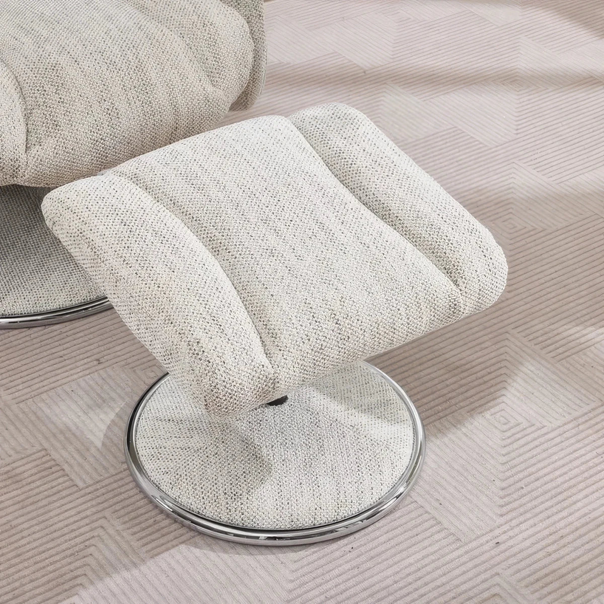 Ottoman Close up of A close-up of a modern Elma fabric swivel recliner chair with footstool  High-back comfort, manual recline and 360° swivel action.