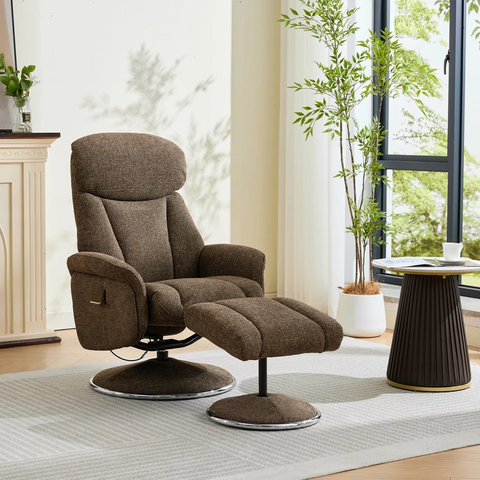 A brown upholstered recliner chair with a matching ottoman in a bright living room setting. The chair features a high back, padded headrest, adjustable armrests, and a swivel base, paired with a matching cushioned ottoman.