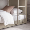 A close-up of the Elodie Elite Bunk Bed frame in a taupe/ warm beige colour