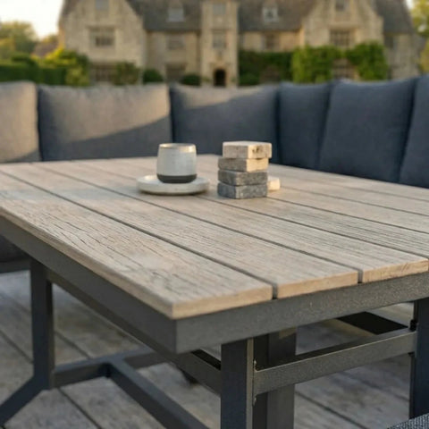 Evershire rising dining table with adjustable height function for outdoor use.