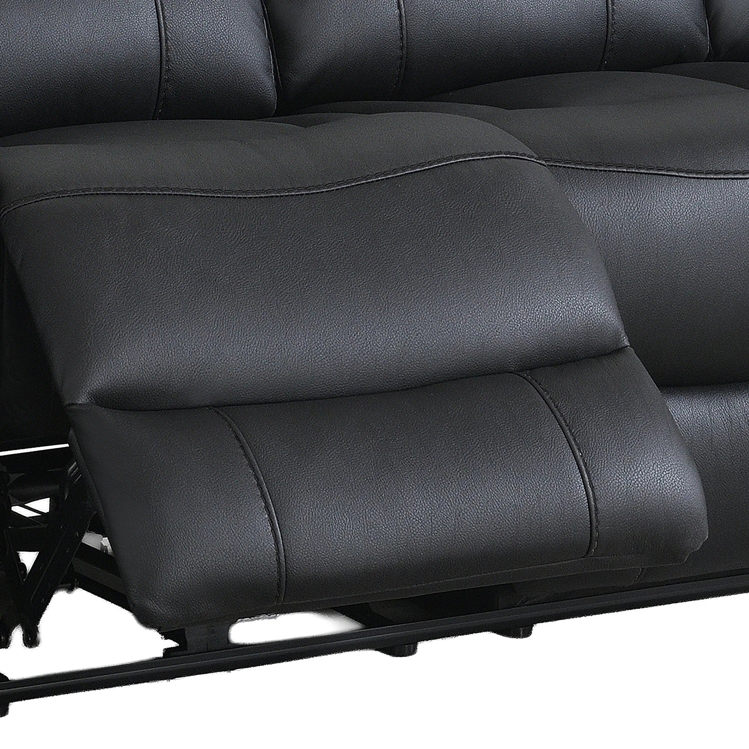Close-up of a black leather reclining sofa seat with the footrest extended, showing padded segmented cushions and stitching details.
