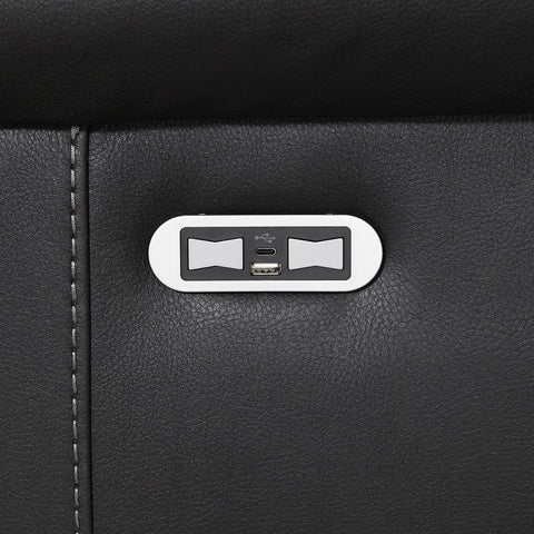 Close-up of a Flynn Black Power Recliner 3 Seater Sofa with a silver oval control panel featuring two bowtie-shaped buttons and a USB-C port.