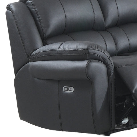 Close-up of a black leather recliner sofa showing the padded armrest, channel tufting, and a small power control panel on the side.