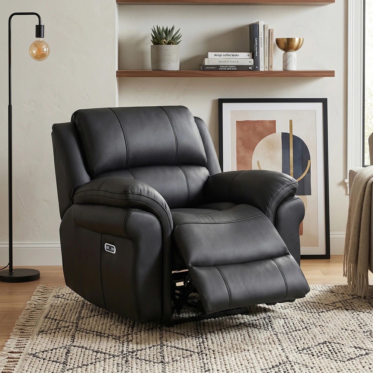 Flynn Black power recliner armchair with premium leather-look fabric, pocket sprung seat, USB charging and smooth electric reclining comfort.