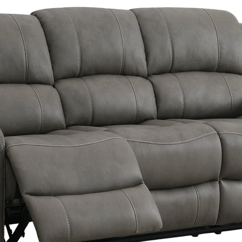 Close-up of a Flynn Power Recliner 3 Seater Sofa in Grey  with padded back cushions, tufted seat panels, and visible contrast stitching. Part of the extended footrest is shown in front.