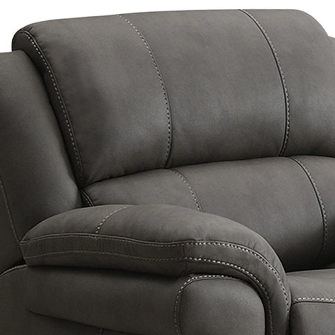Close-up of Flynn Grey Leather Look Electric Recliner Chair with USB ports showing the padded backrest, armrest, and contrast stitching.